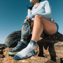 Darn Tough Women's Hiker Quarter Midweight Hiking Sock in Mountain White - on the trail