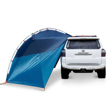 Kelty Backroads Shelter attached to a vehicle, sides unrolled